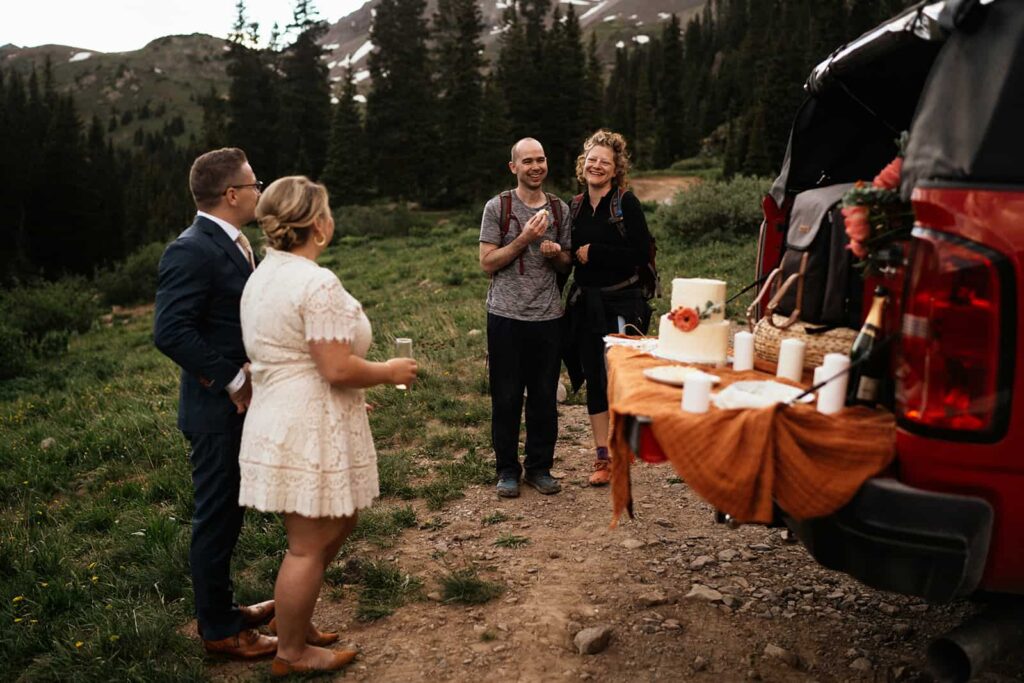cutting the cake at colorado elopement
