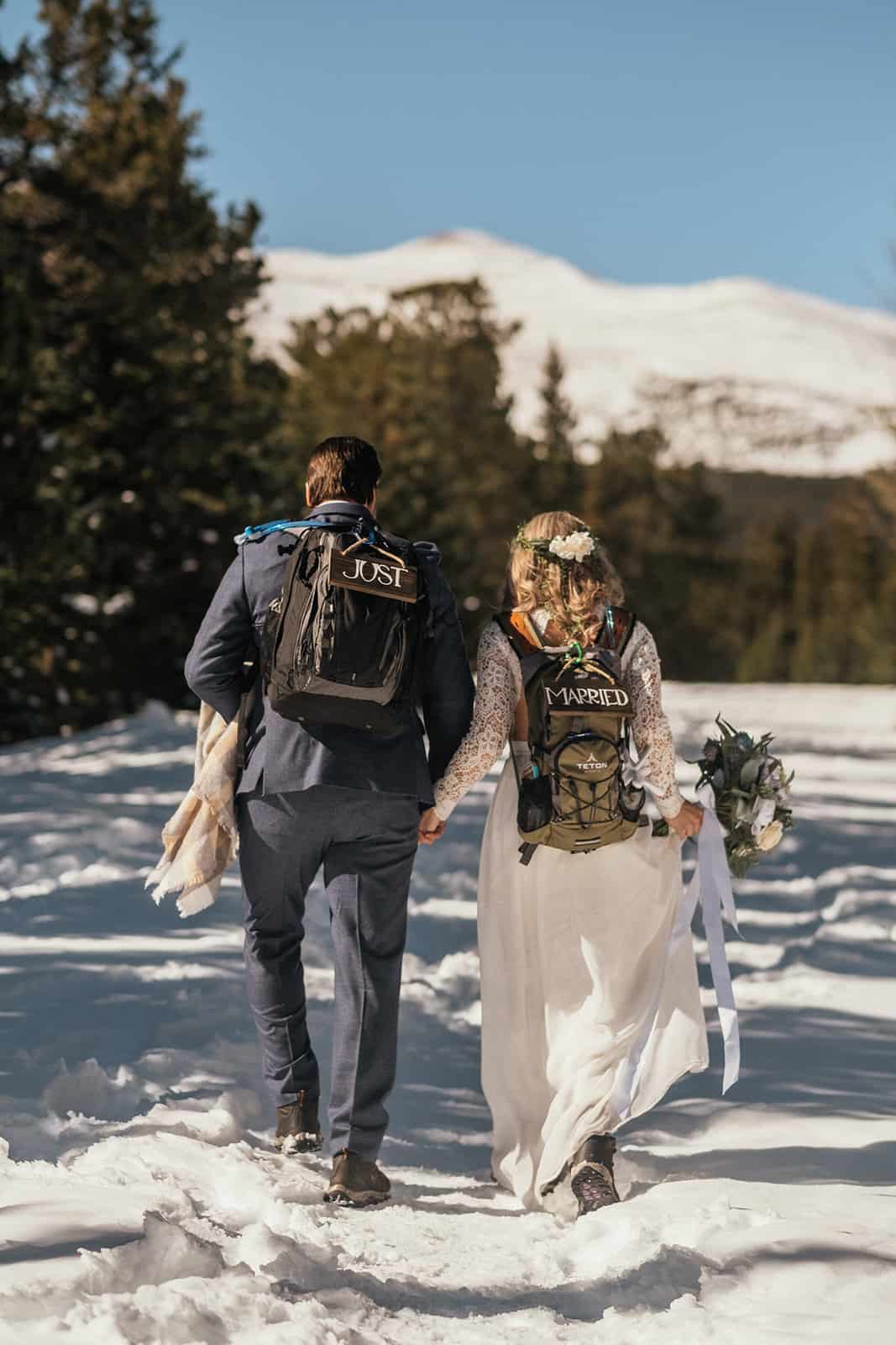 couple hiking at winter elopement in Colorado