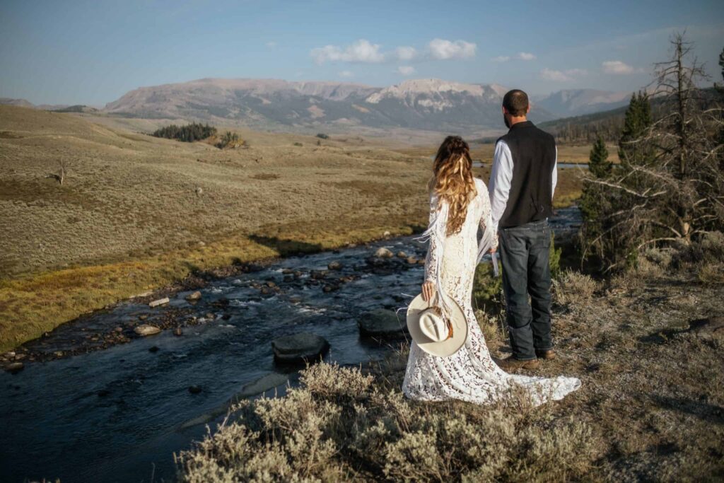 couple eloping near river in wyoming