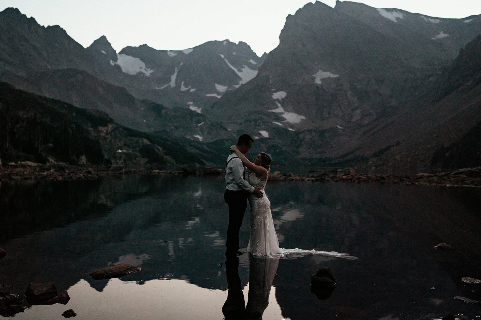 Couple in water at lake Isabelle at colorado elopement