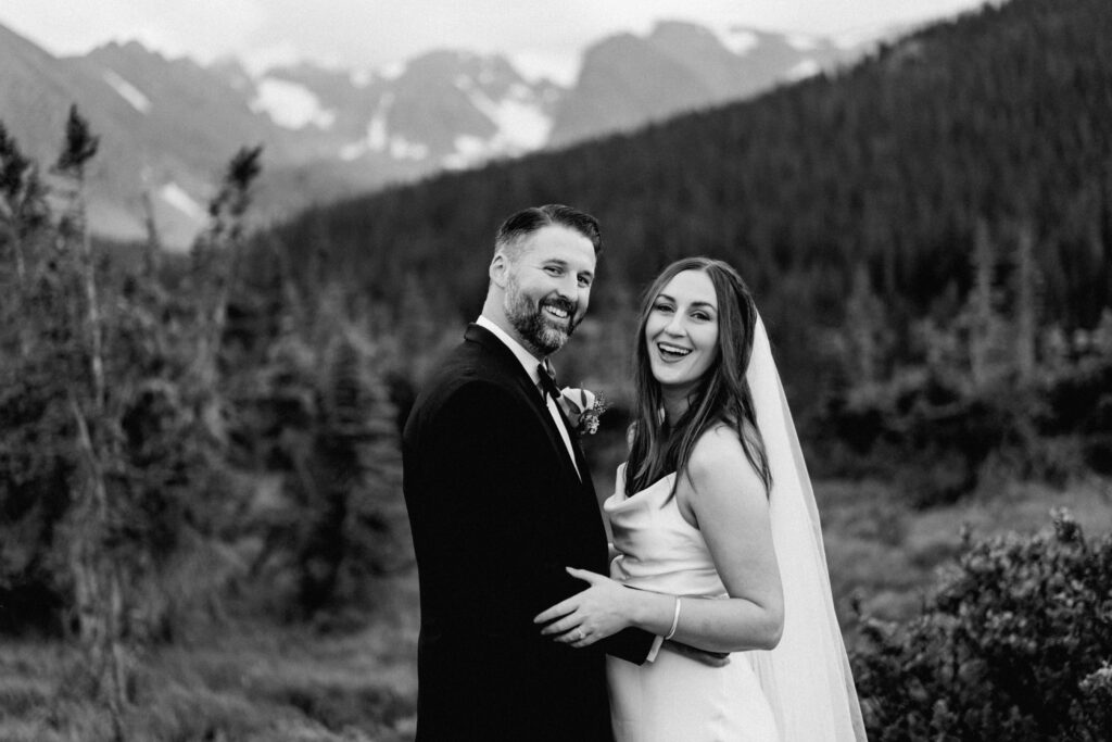 Happy bride and groom on wedding day in the Indian Peaks Wilderness in Colorado.