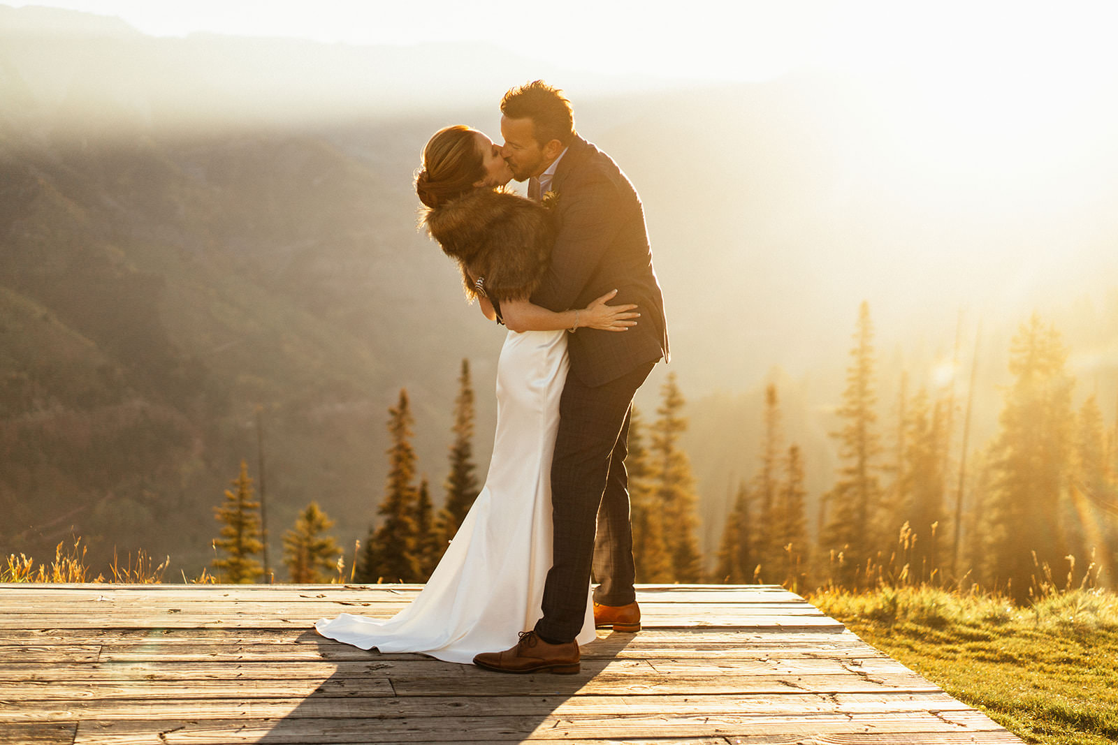 bride and groom kiss on top of the mountain at telluride colorado luxury elopement